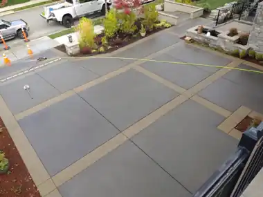 Driveway with Decorative Tan Bands by Down Right Concrete, Puget Sound area