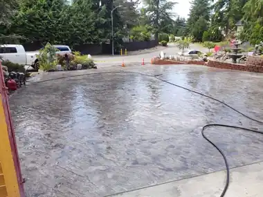 Seamless Slate Stained Stamped Driveway in Snohomish, WA by Down Right Concrete